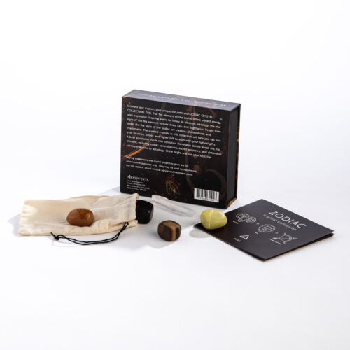 Zodiac product set with stones, packaging, and card on a white background