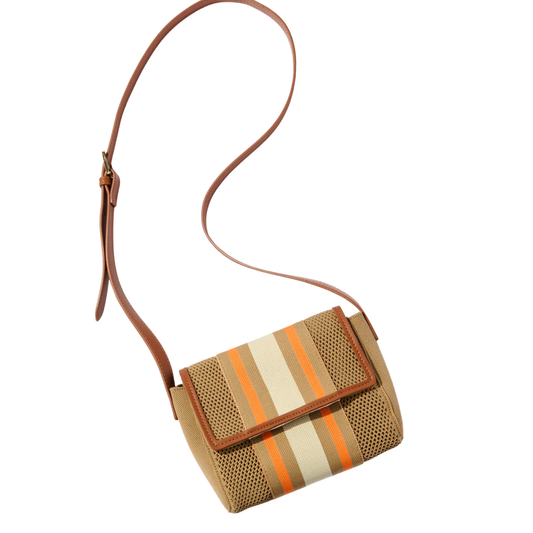 Small handbag with striped pattern and brown strap on a white background