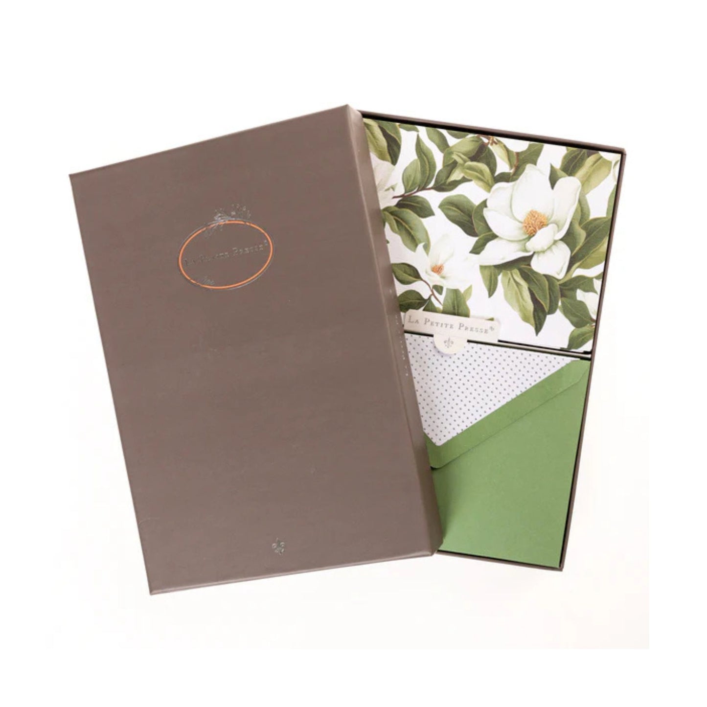 Boxed note cards with a decorative cover featuring magnolia and leaves on a white background