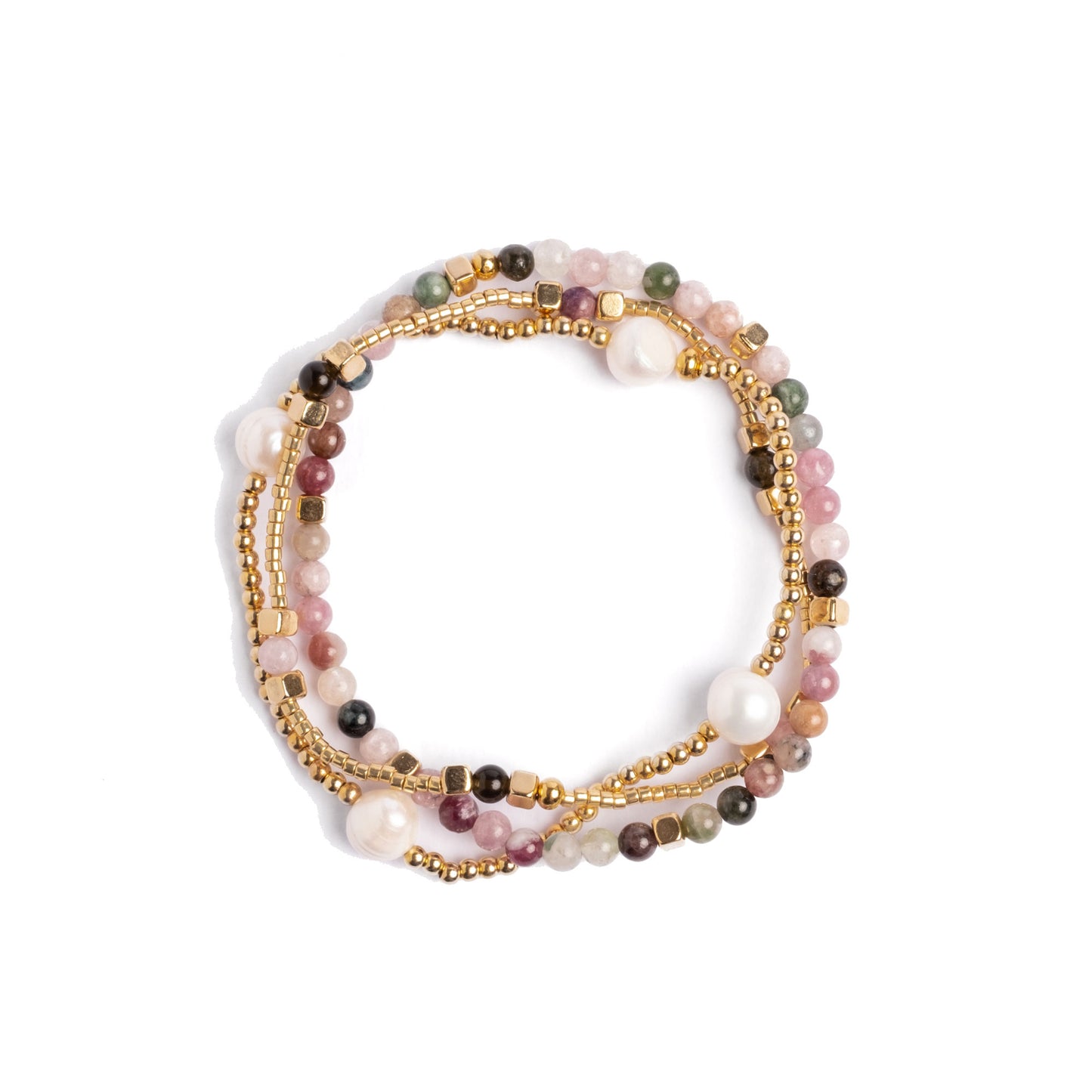 Set of three beaded bracelets with gold accents on a white background