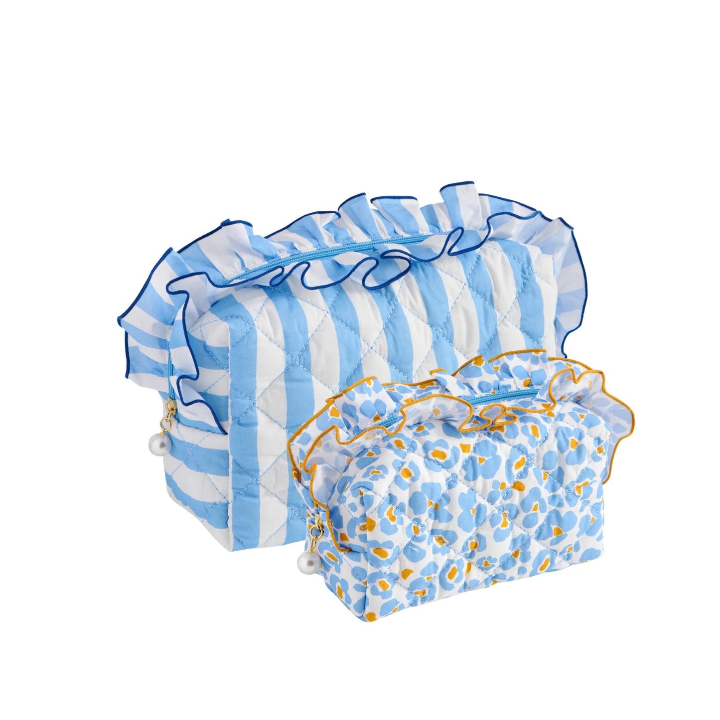 Two quilted fabric pouches on a white background. The larger pouch has light blue and white vertical stripes with blue ruffle trim, and the smaller pouch has a blue and white spotted pattern with yellow-orange accents and blue ruffle trim.