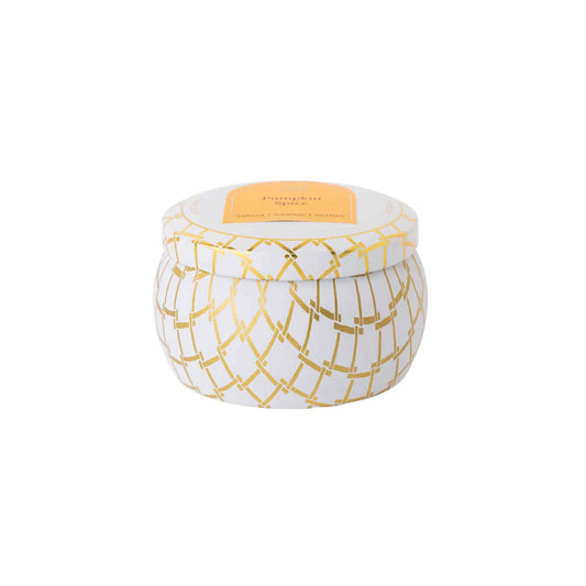 Decorative pumpkin spice scented candle in a tin with gold geometric pattern on a white background