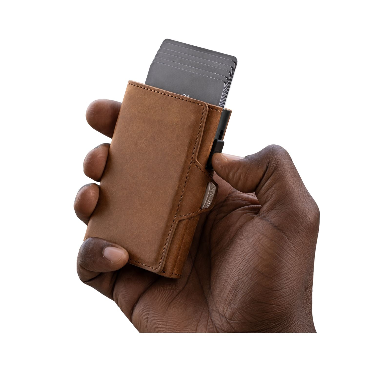 Hand holding a brown leather wallet with a card holder on a white background