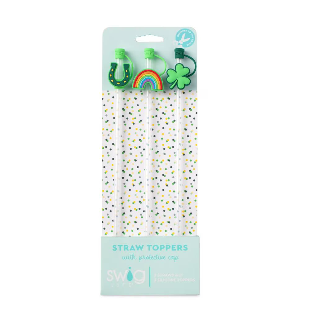 Packaged straw toppers with decorative ends on a white background