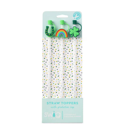 Packaged straw toppers with decorative ends on a white background