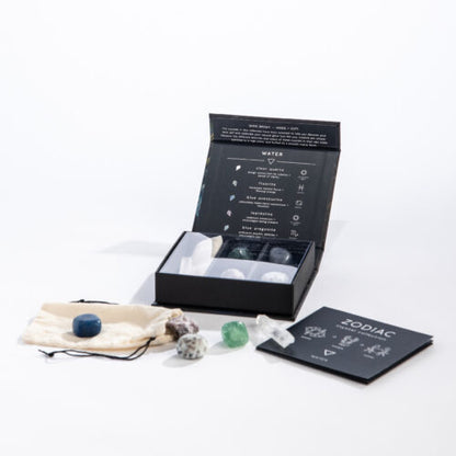 Crystal set water with zodiac-themed packaging on a white background