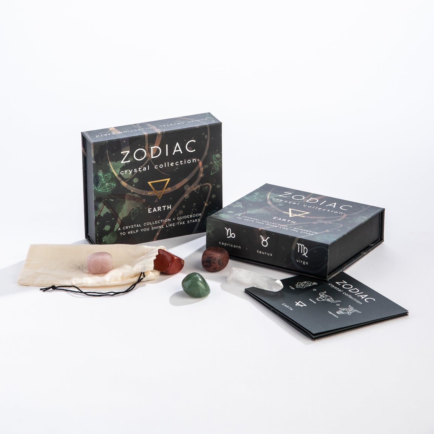 Zodiac crystal collection packaging with crystals and accessories on a white background