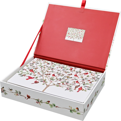 An open gift box with a red interior lid and a white exterior decorated with a bird tree illustration. The box is shown on a clean white background, with a red ribbon handle visible at the top.
