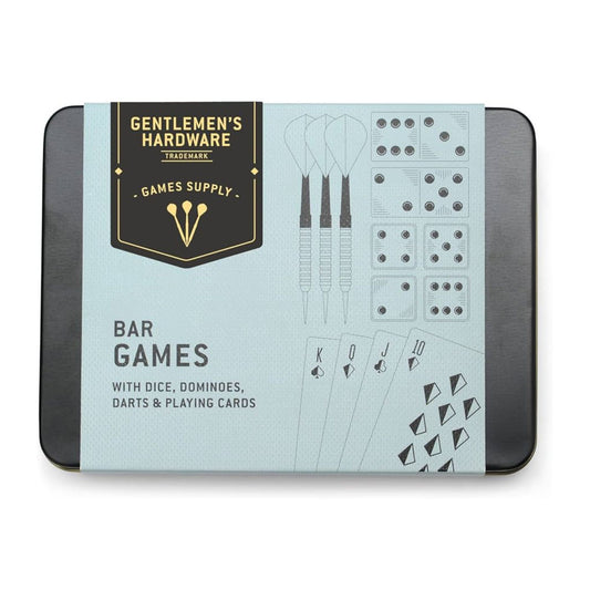 A boxed bar games set by Gentlemen's Hardware, featuring dice, dominoes, darts, and playing cards in a rectangular tin with a pale blue front label and dark gray sides.
