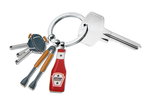 Keychain with key and ketchup bottle design on a white background