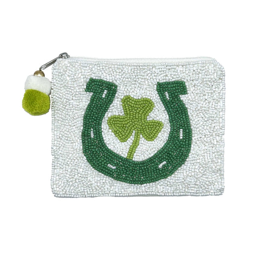 Pouch with green horseshoe and shamrock design on a white background