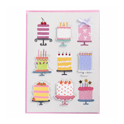 Set of colorful cake-shaped stickers on a white background