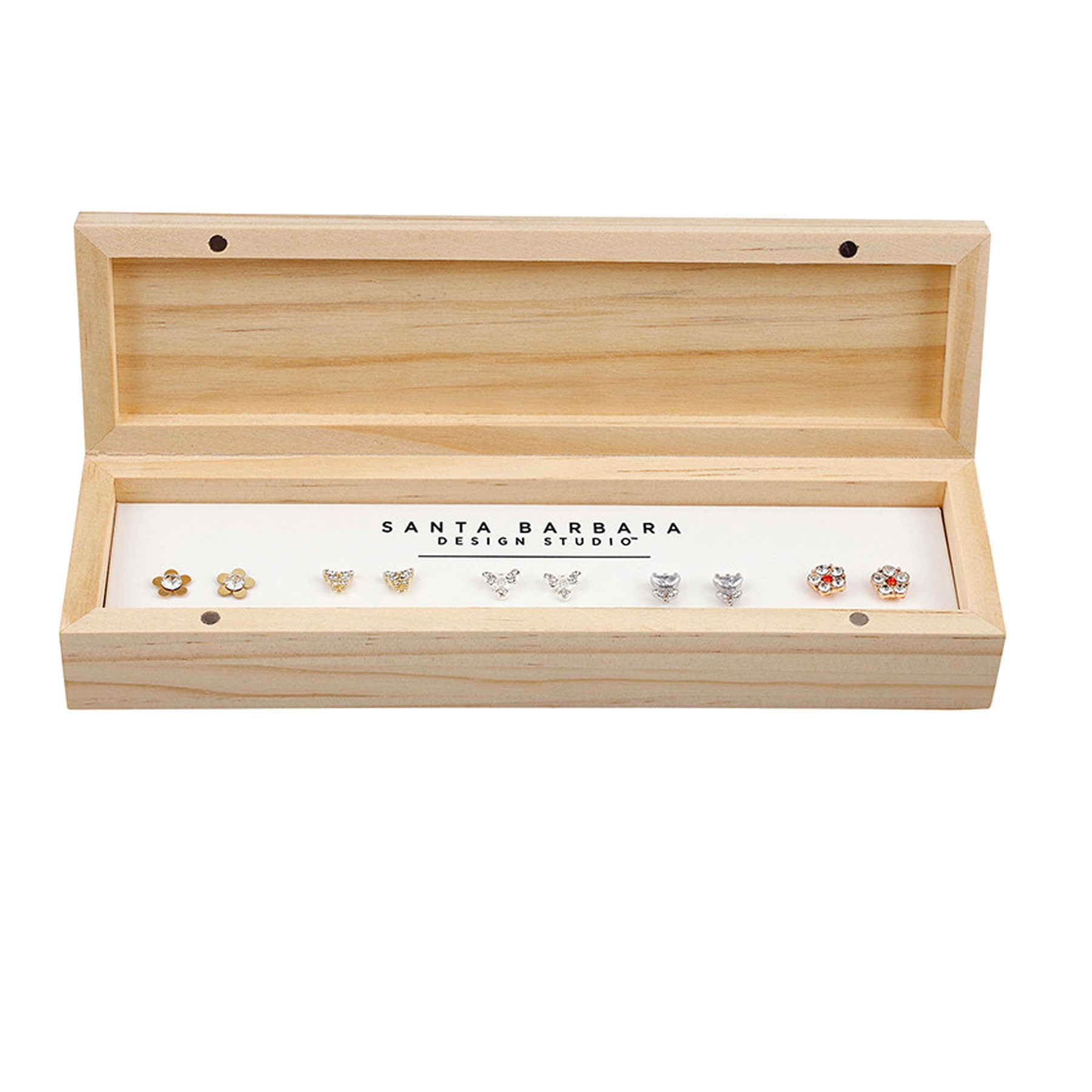 Wooden jewelry box with earrings on a white background