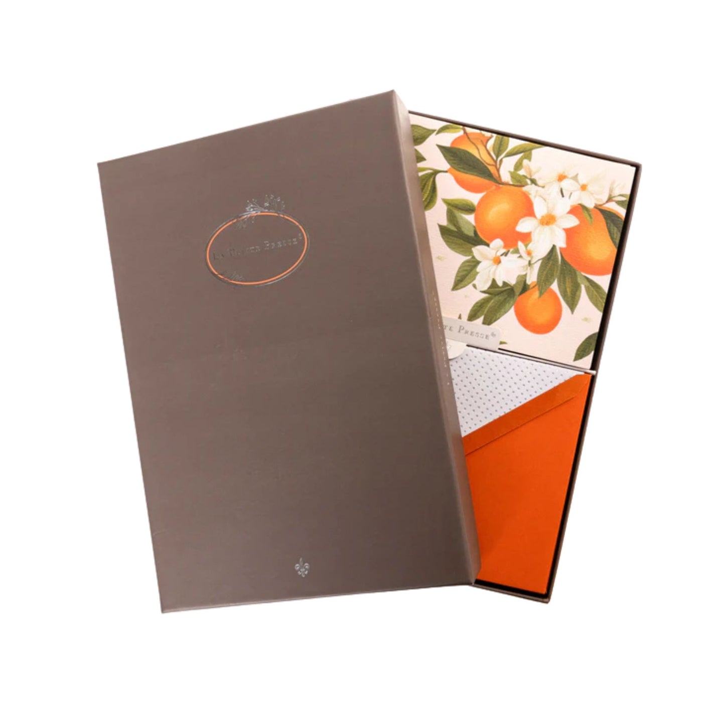 Open gift box with floral and oranges design note cards on a white background