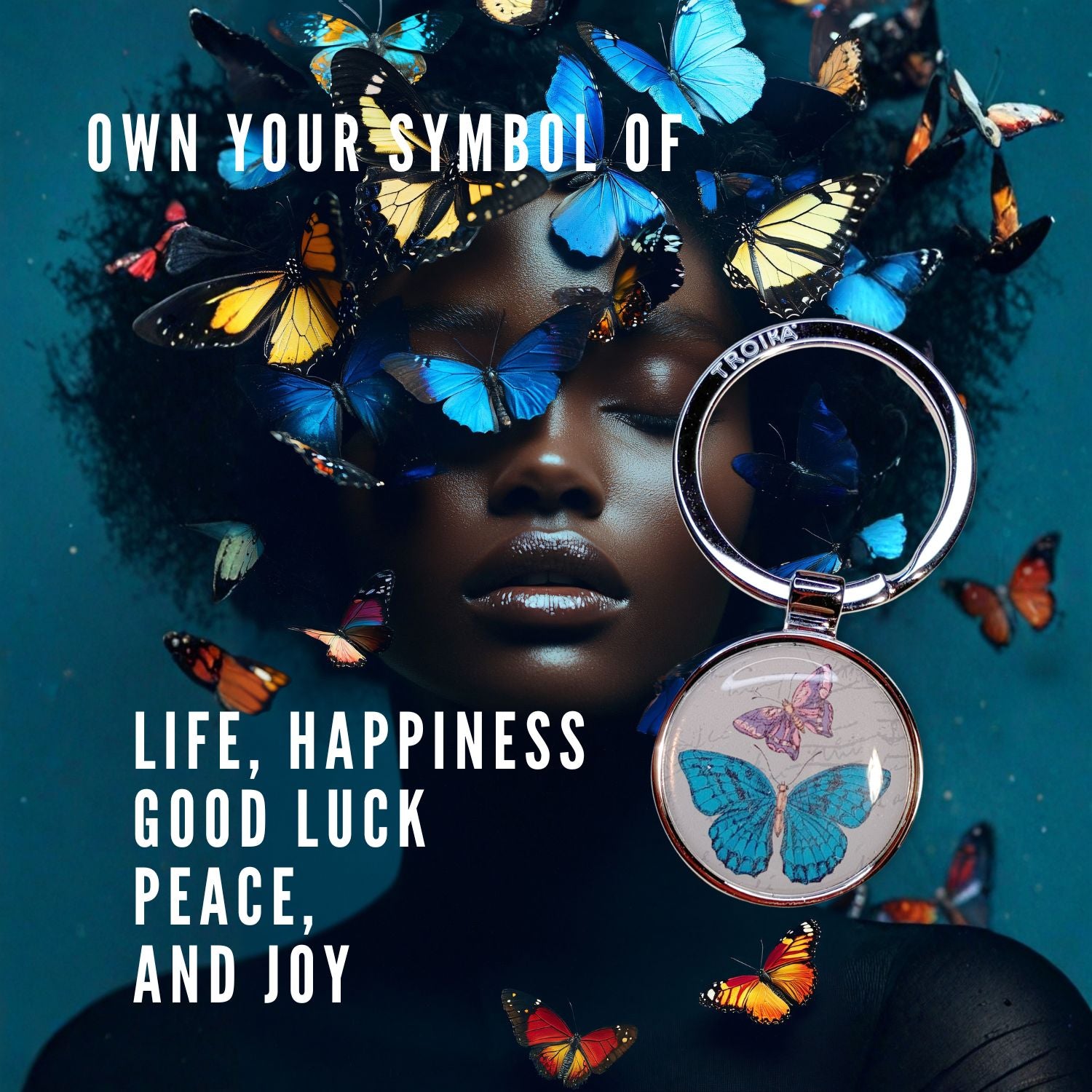 Keychain with butterfly design on a person surrounded by butterflies against a dark background