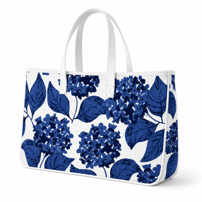 Blue hydrangea canvas tote bag with white handles,
