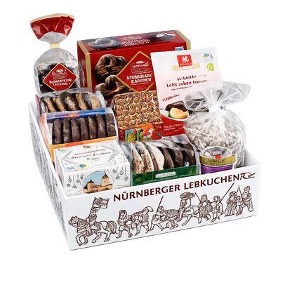 Assorted German cookies and pastries in a decorative box with 'Nürnberger Lebkuchen' branding.