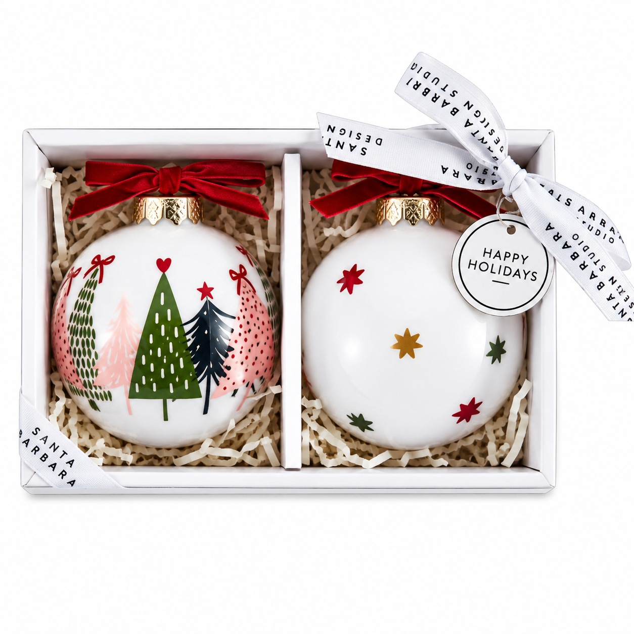 Boxed set of two glass Christmas ornaments with festive tree and star designs, red velvet bows, and elegant holiday gift packaging.