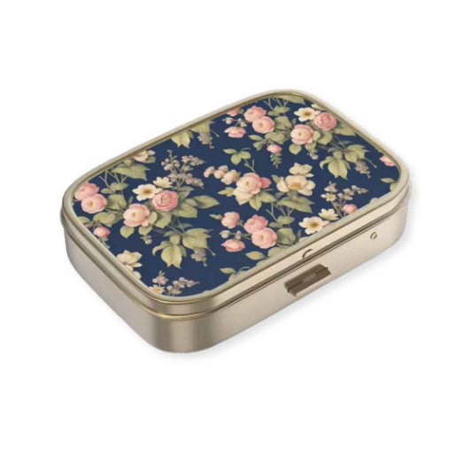 Rectangular dark blue floral pillbox with vintage flower design and compact travel size
