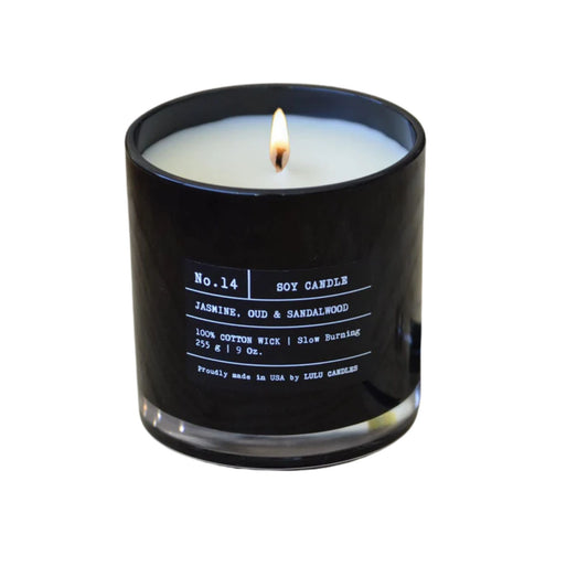 Black soy candle with a white label on a white background