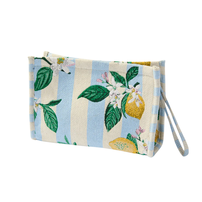 Fabric wristlet with lemon and leaf pattern on a white background