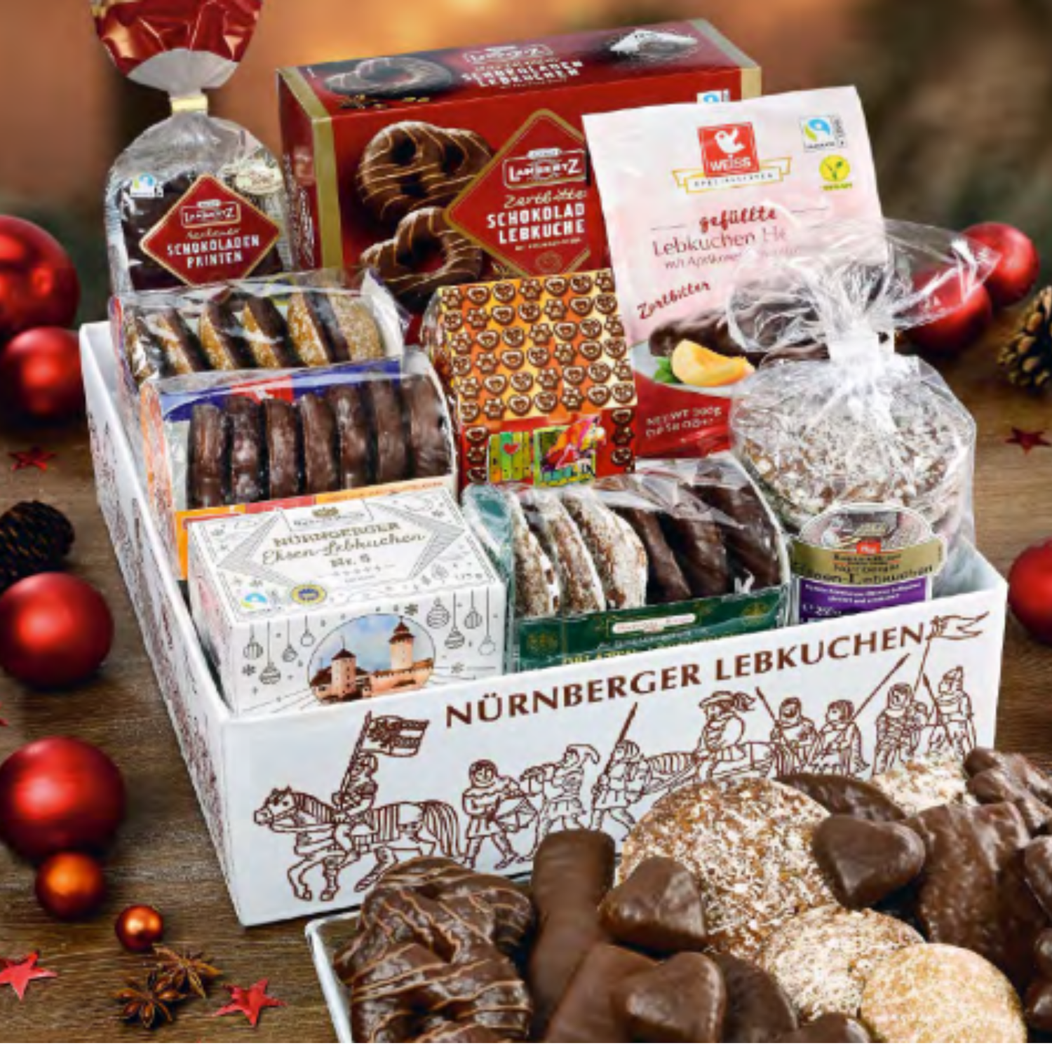 Gift box of Nürnberger Lebkuchen with various types of cookies on a wooden surface.