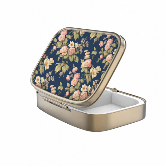 Portable rectangular pillbox featuring delicate botanical artwork and divided interior