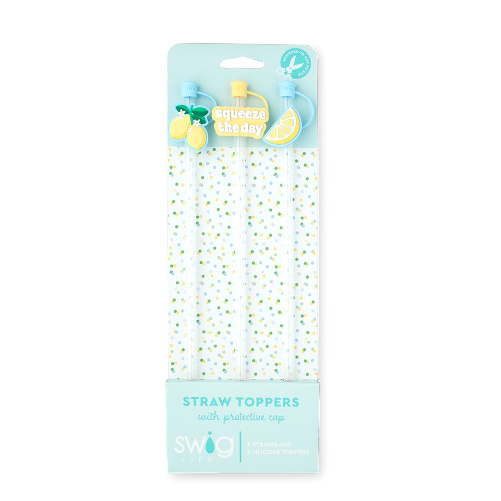 Packaged straw toppers with protective caps on a white background