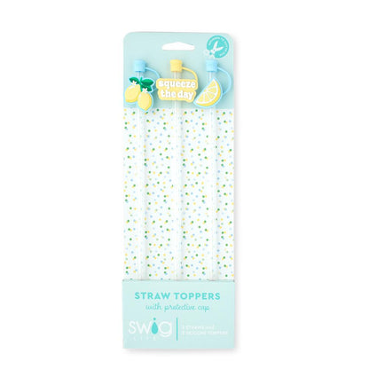 Packaged straw toppers with protective caps on a white background