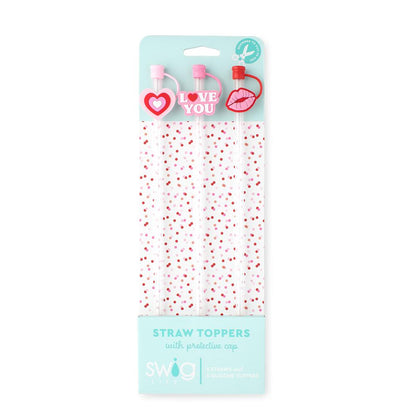 Packaged straw toppers with heart and lips designs on a light blue background