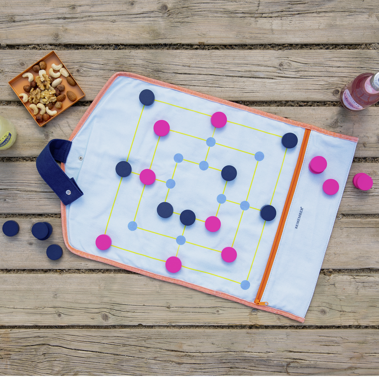 Colorful game board with markers on a wooden surface