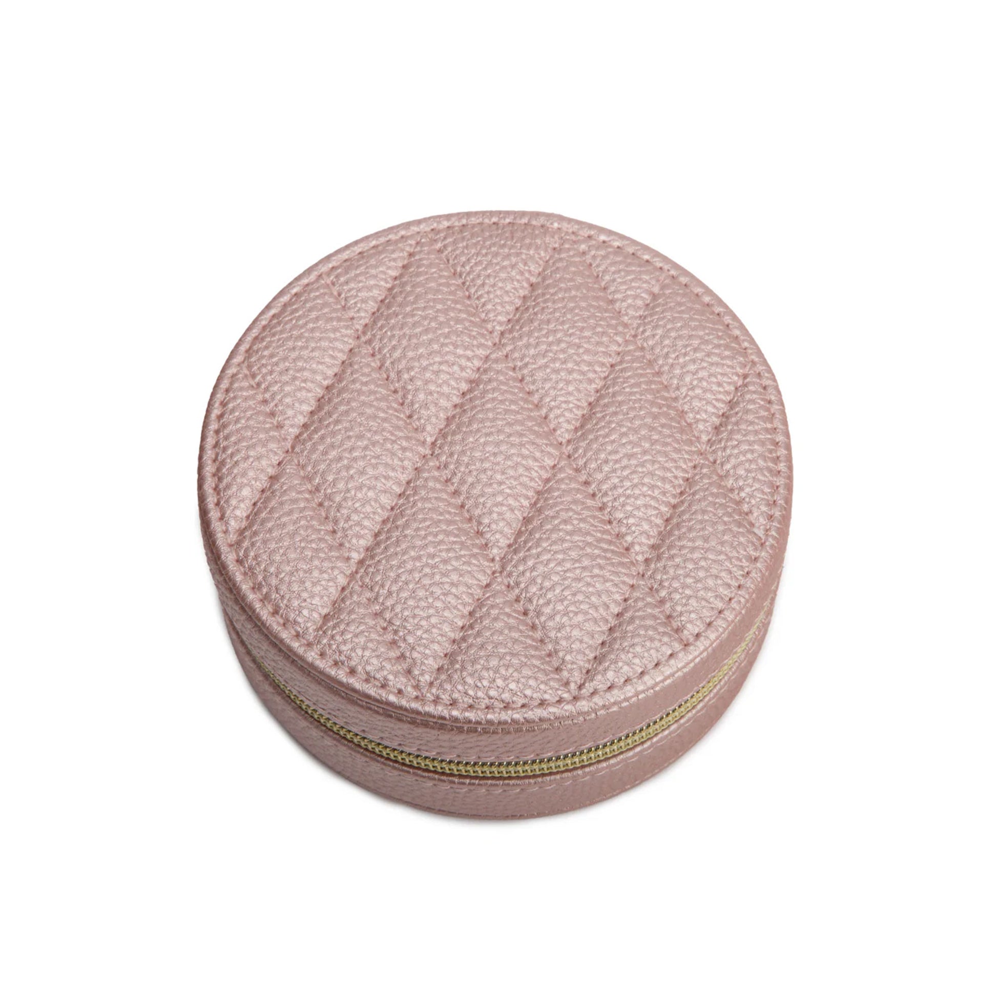Round pink textured jewelry box with a gold zipper on a white background