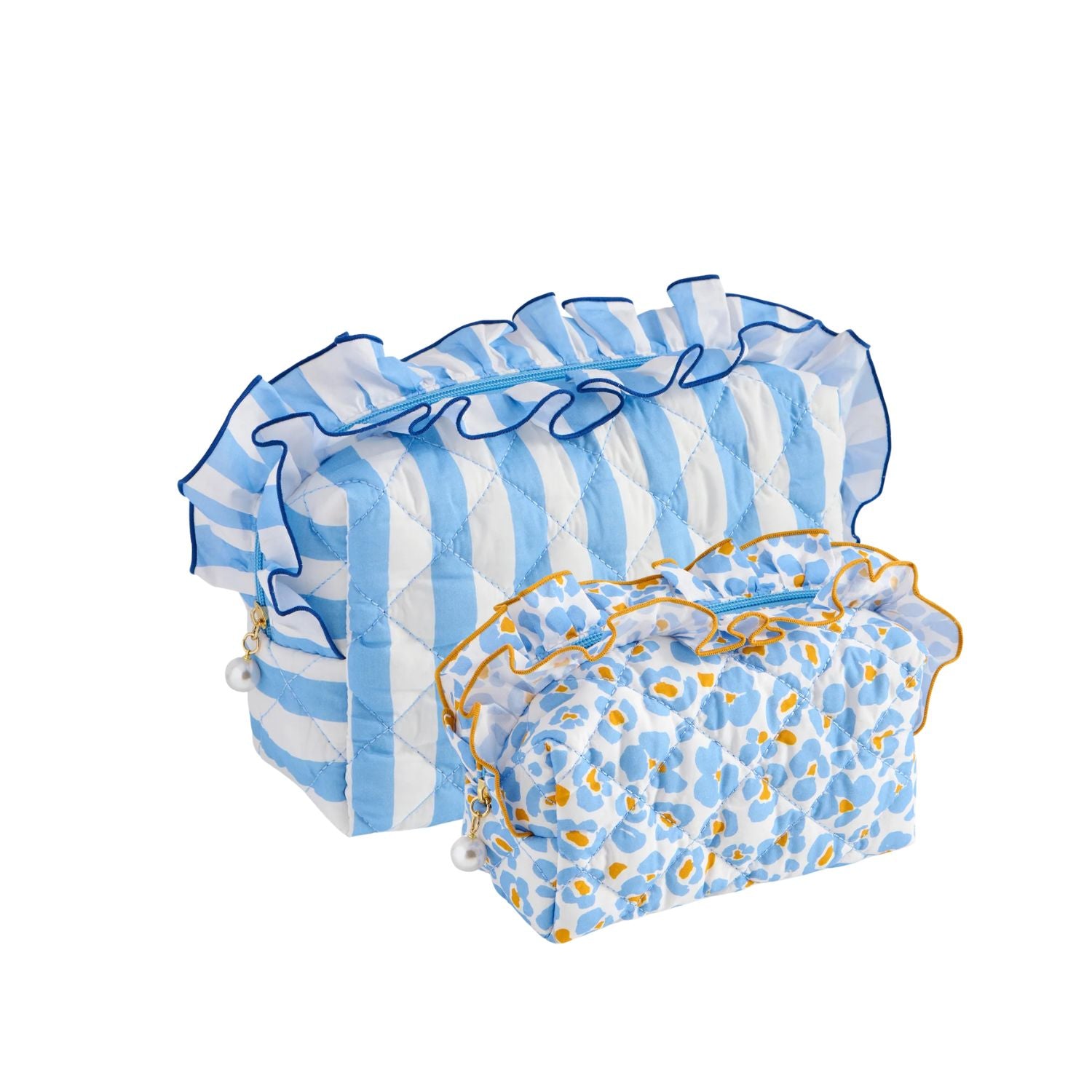 Two quilted fabric pouches on a white background. The larger pouch has light blue and white vertical stripes with blue ruffle trim, and the smaller pouch has a blue and white spotted pattern with yellow-orange accents and blue ruffle trim.