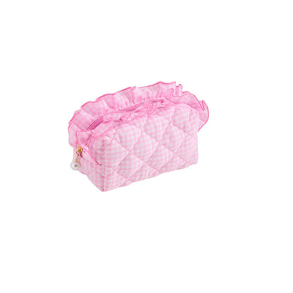 A pink quilted cosmetic pouch with a gingham pattern, featuring a ruffled top trim and a small pearl charm with a gold ring, shown on a plain white background.