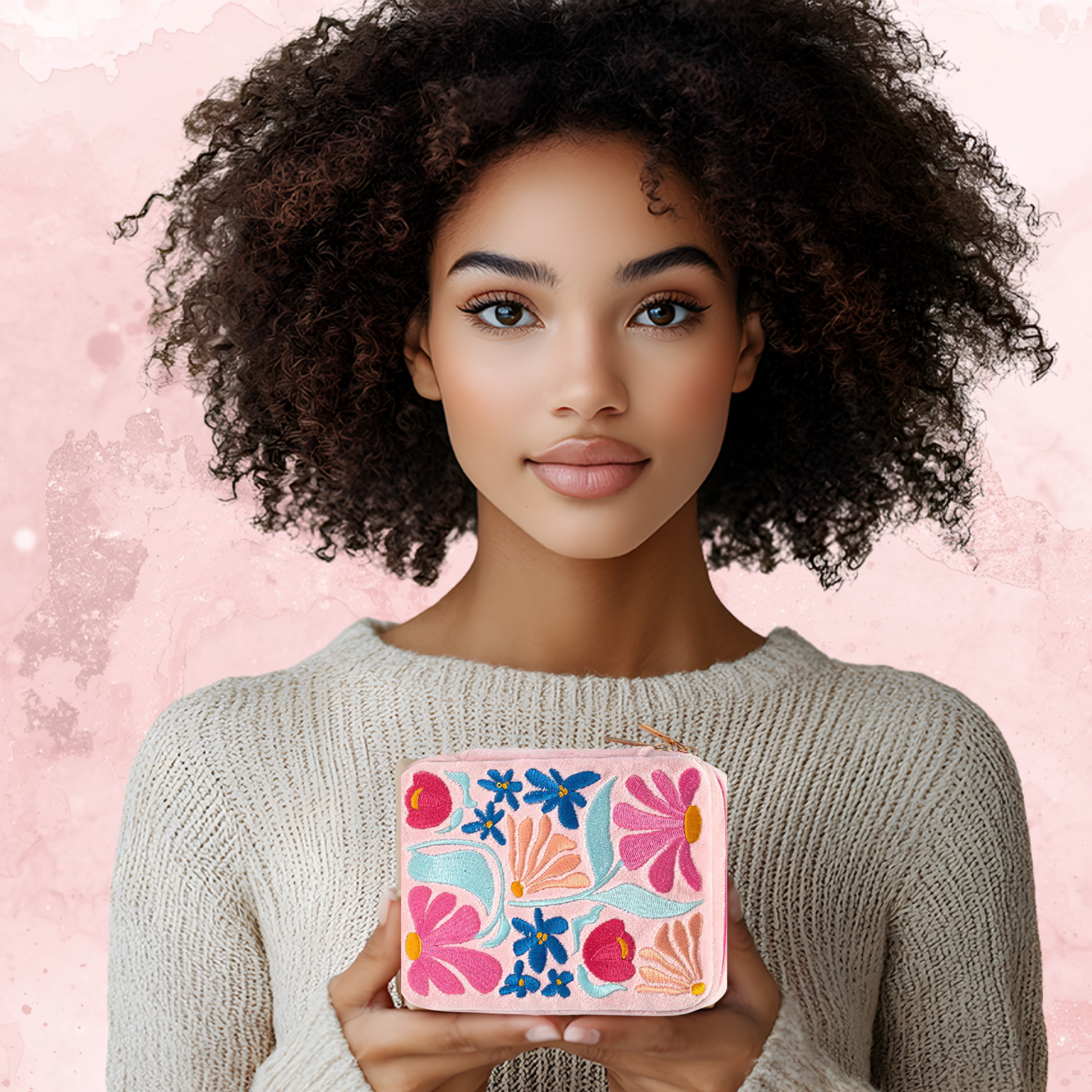 Woman holding a floral pink clutch against a pink background