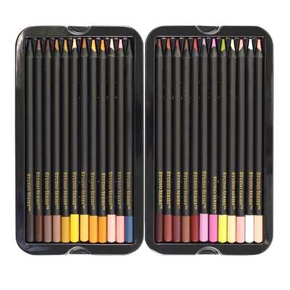 Set of colored pencils in a black metal case on a white background