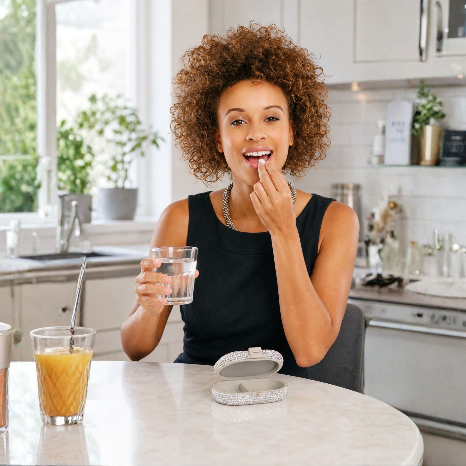 Woman taking vitamins using silver crystal pillbox at home