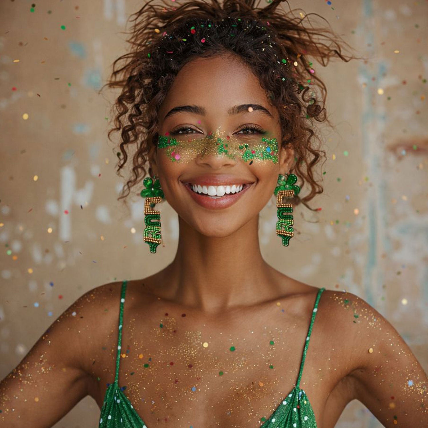 Woman with green glittery makeup and earrings against a festive background