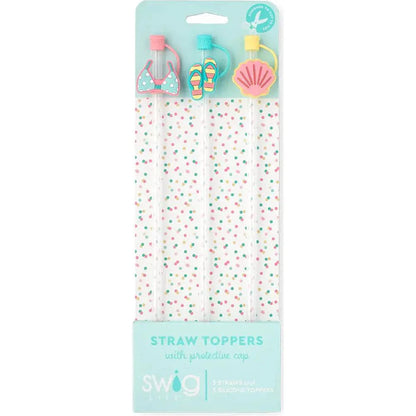 Packaged straw toppers with decorative elements on a white background