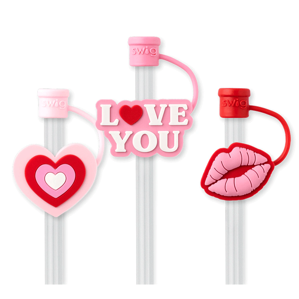 Three colorful straws with decorative ends on a white background