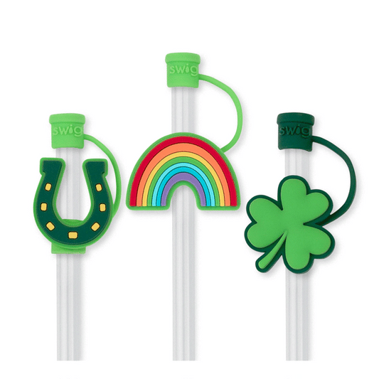 Three straw toppers with colorful designs on a white background