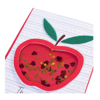 Red apple-shaped card with decorative elements on a white background