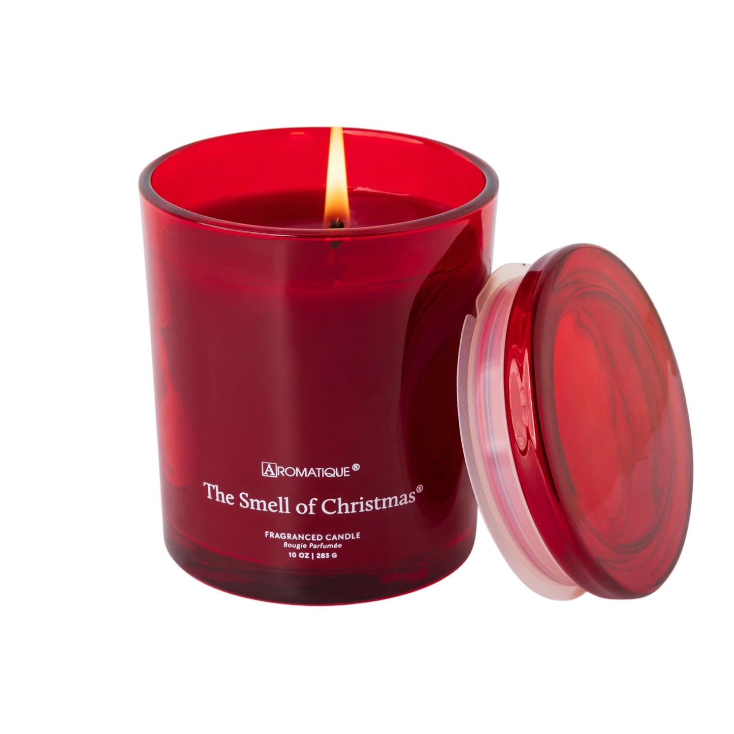 Red candle with a lit wick and lid on a white background, featuring the brand 'Aromatique'.