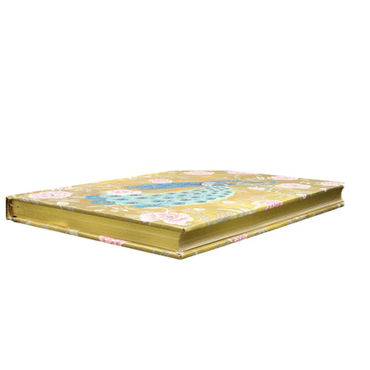 Decorative medium sized journal with floral patterns on a gold background